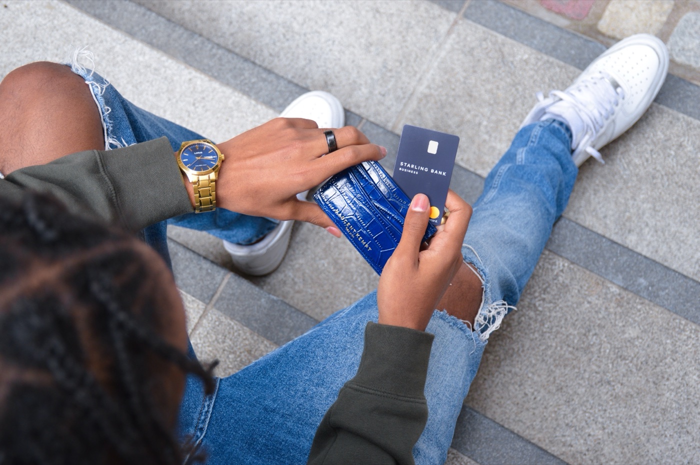A leather cardholder and a business bank card